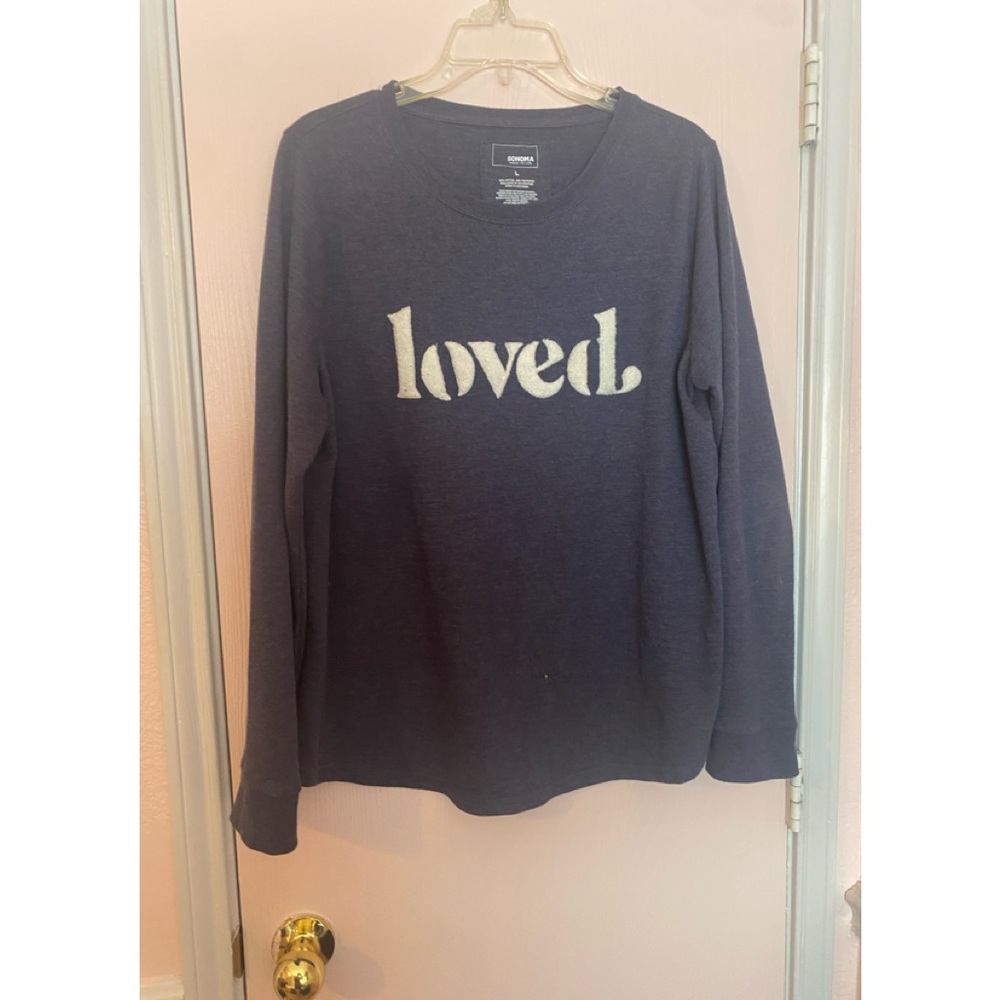 Navy blue sweater that says loved